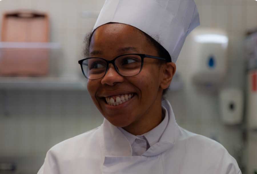 young trainee chef wearing a chef hat