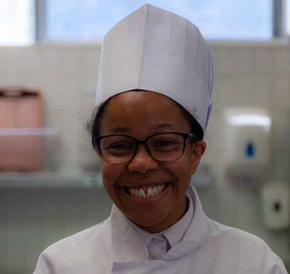 young trainee chef wearing a chef hat
